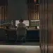 Crypto enthusiast monitors market trends on computer screens.