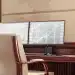 FN Capital's AI trading platform on dual monitors displaying charts.