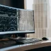 AI-powered currency trading charts on a monitor.