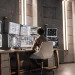 AI investing bot analyzes market data on computer screens.