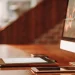 Elite AI financial assistant managing finances on a computer, tablet, and smartphone.