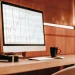 FN Capital free trial: AI-powered EUR/USD trading charts on a computer screen.