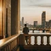 Investor overlooking city skyline. Passive income from stock trading.