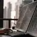AI trading app displayed on dual monitors.