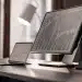 ETF trading bot analyzing stock charts on monitors.