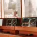 AI stock picker analysis on computer monitors.
