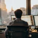 Calm trader monitors market data, mastering trading psychology for consistent profits.