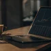 AI stock trading bot analyzing charts on a laptop.