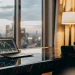 MSCI World Index chart on a laptop with city view.